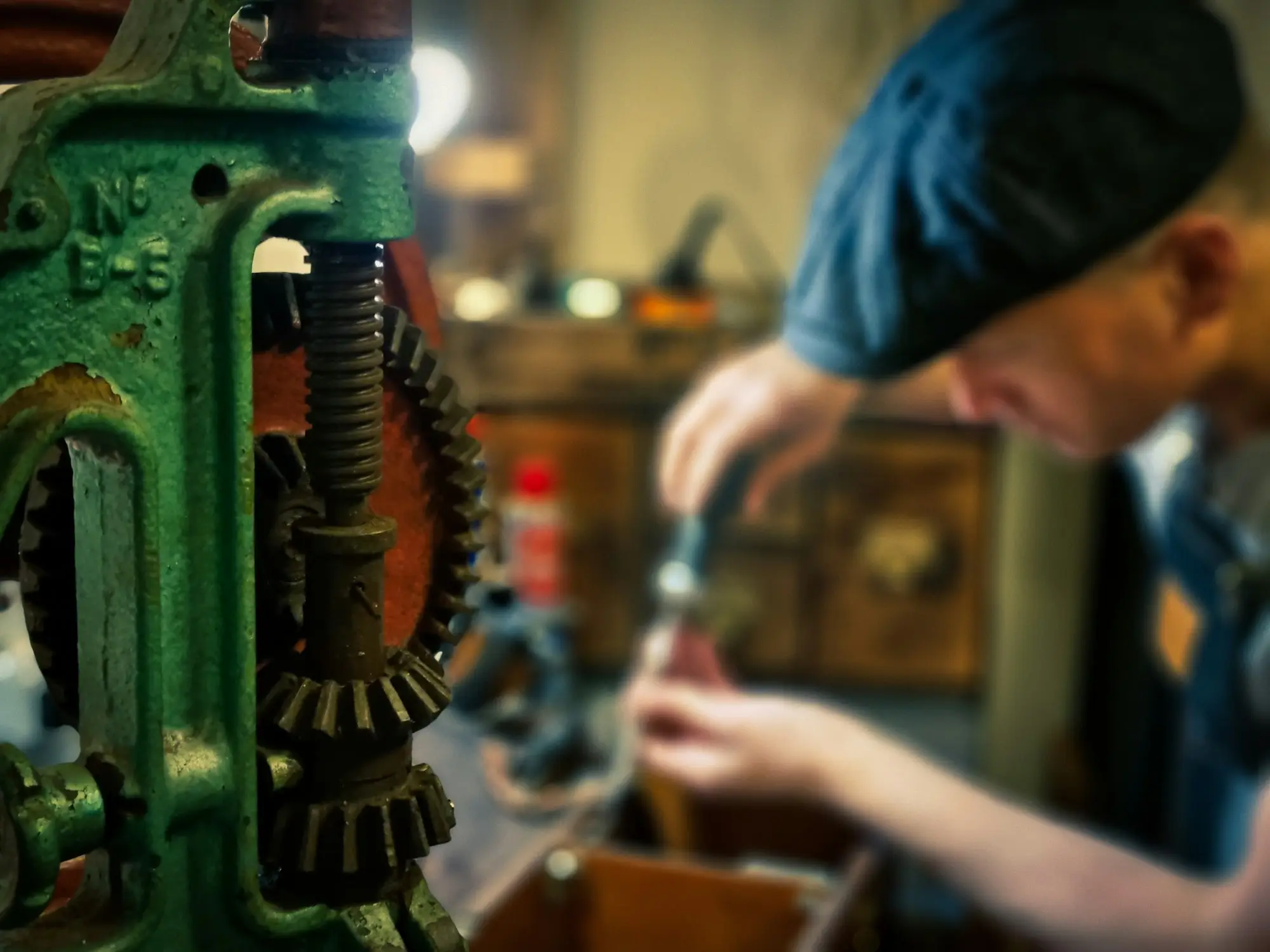 Technician repairing machinery with a power tool