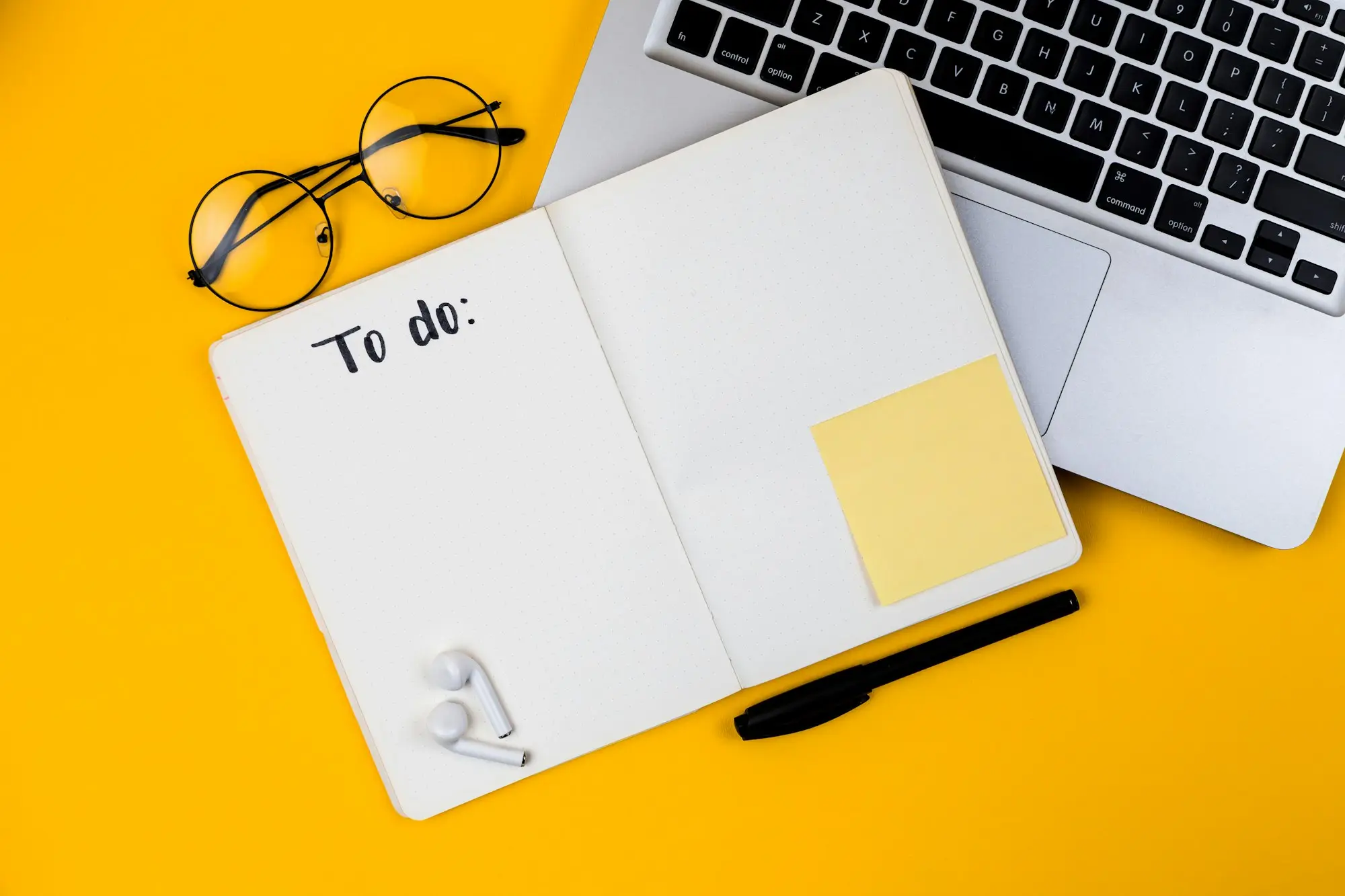 Checklist and documents on a laptop